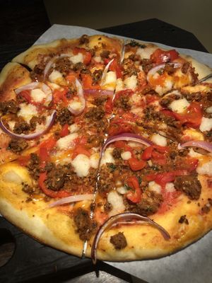 SWEET PEPPER + SAUSAGE
San Marzano Tomato Sauce, Cashew Mozzarella, House-made Italian Sausage, Red Peppers + Onions, Hot Honey at Virtuous Pie in Victoria