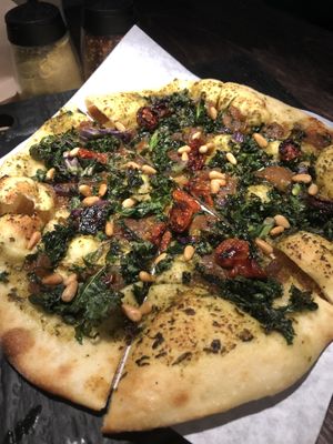 ULTRAVIOLET
Walnut + Arugula Pesto, Cashew Mozzarella, Oven Dried Tomatoes, Kale, Caramelized Onion, Pine Nuts
 at Virtuous Pie in Victoria