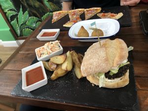 Veganuary special burger, “Rio” pizza, coxinha at Brasil Vegano Cafe in Guildford