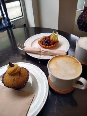 Vanilla muffin and chocolate tarte with cappuccinos at Odete Bakery in Porto