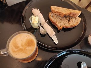 Breakfast with amazing rosemary wheat bread at Odete Bakery in Porto