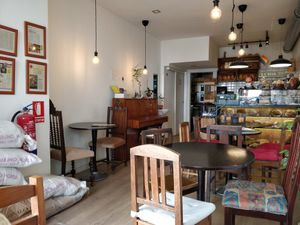 Really lovely seating and view of the street from the window; so many options for baked goods at Odete Bakery in Porto