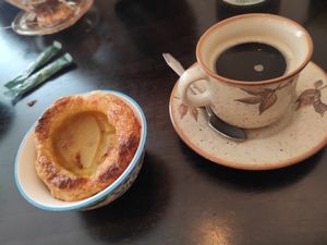 Nata and coffee at Odete Bakery in Porto
