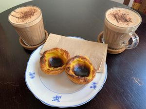 Vegan pastel de nata and hot chocolate. A heavenly treat!  at Odete Bakery in Porto
