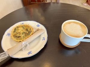 Quiche and capuccino  at Odete Bakery in Porto