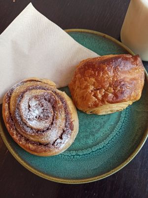 Cinnamon roll and pain au chocolat at Odete Bakery in Porto