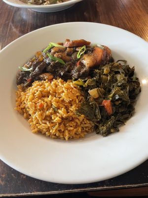 Oxtail style mushrooms, yellow rice, and collards  at Desmond's Island Soul Grill in Virginia Beach