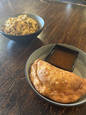 Lentil empanada with Mac & cheese  at Desmond's Island Soul Grill in Virginia Beach