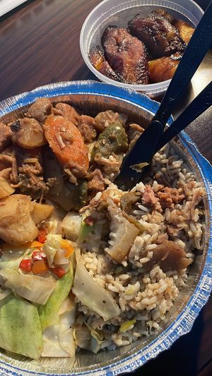Brown stewed jackfruit, rice and peas, cabbage and plantains  at Desmond's Island Soul Grill in Virginia Beach