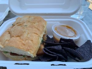 seitan reuben sandwich with nachos and cashew cheese at Flourish Plant-Based Eatery in Evansville