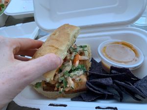 seitan reuben sandwich with nachos and cashew cheese at Flourish Plant-Based Eatery in Evansville