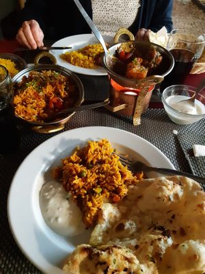 Vegetable biryani with raita, aloo gobi and garlic naan  at India Gate in Funchal