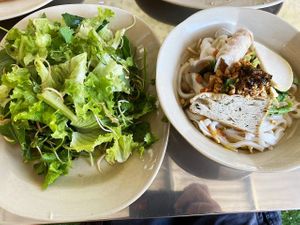 Local noodle dish served with greens at Huong Tu Bi in Hoi An