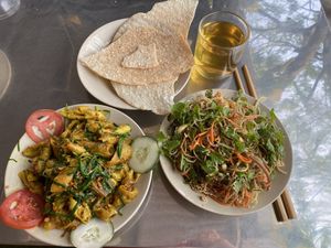 Seitan (mock meat), shallots and tumeric stir fry with rice crackers. at Huong Tu Bi in Hoi An