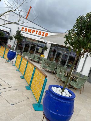 Exterior with outside seating at Comptoir Libanais in Ashford