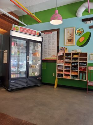 Inside merch, ready made juices, and snacks at JuiceLand - Frost Tower in Austin