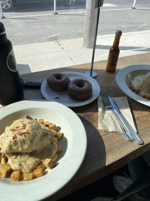 Smothered chikn biscuit and chocolate donuts 🍩   at The Fix in Kansas City