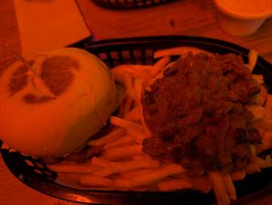 Horrible photo of a delicious burger with chili fries at The Winston in Hobart