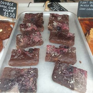 Fallen sign says coconut and cherry brownie 😊 at Luminary Bakery in North West London