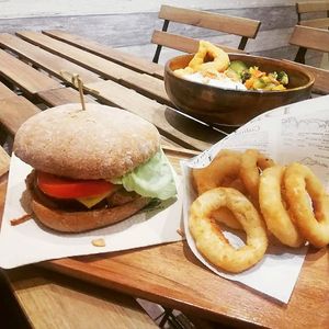 Burger and onion rings at Loving Hut in Louvain-la-neuve