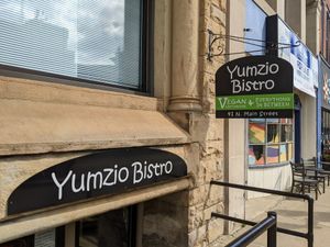 Signs at Yumzio Bistro in Greensburg