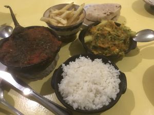 Aubergine-Wannas-Way (very good 😋) with potatoes (=fries) and cauliflower curry with rice    at Wannas Art Cafe in Luxor
