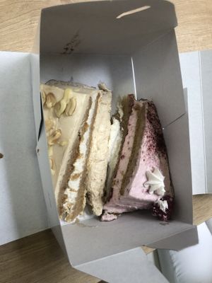 White snickers cake & white chocolate and raspberry cake to go. at Kavarnica CukrDoza - Maybe closed in Maribor