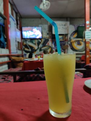 Drinking and watching friends at Victor Place in Vang Vieng