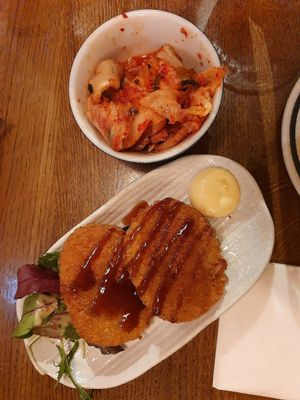 Pumpkin fritters and kimchi starters/sides at Takumi in Rotterdam
