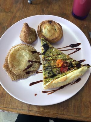 The round one was the one with mushrooms and was creamy. Yum!  at Vegan Box in Faro