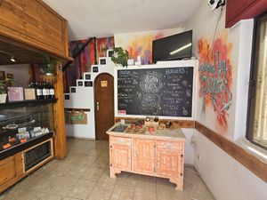 Downstairs and menu at Vegan Box in Faro