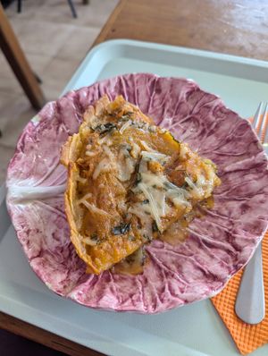 "Pizza" with caramelized onions baked into it. at Vegan Box in Faro