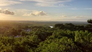 Panorama view of the region. The vegan pousada is right on that river, unnoticeable in the picture due to its preserved green coverage. at Pousada Casinha Amarela in Cairu