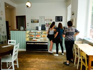 Counter full of amazing vegan pastries where you order inside Vux at Cafe Vux in Berlin
