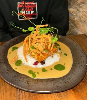 Sweet chilli, maple and lime glazed tofu, coconut & fruit rice, curry sauce & bhaji  at Nant Y Felin in Denbigh