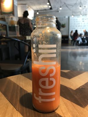 Reviiv (soooo delicious! Carrot, ginger, tumeric, pineapple)  at freshii in Lima