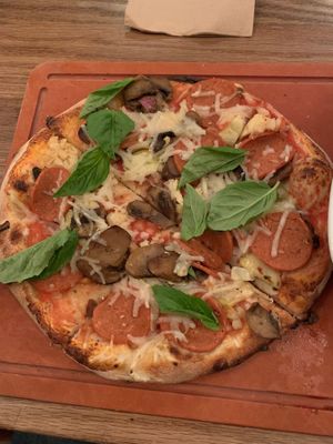 Create your own pizzetta with daiya cheese, vegan pepperoni, basil, mushrooms, artichokes and roasted garlic at Famoso Neaopolitan Pizzeria in Regina
