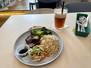 Marinated tempeh, steamed broccoli, brown rice and pickled veg, and citrus iced tea    at Gentlebros Cafe in Central Singapore