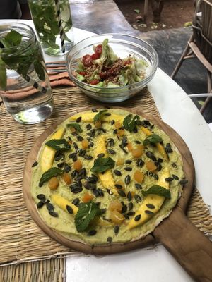 Pizetta topped with guacamole & mango  at La Famille in Marrakech