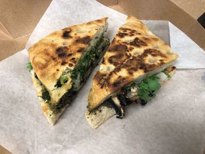 Vegan options in the cafe inside. Shown here: Portobello pesto panini (vegan). at Hawaiian Moons Market in Kihei