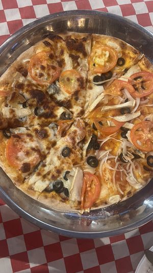 Right side without cheese. Adds: tomatoes, olives, onions, mushrooms  at Little Red Oven in Trat