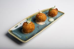 Feta, sun-dried tomato & herb arancini at nosh MERIMBULA in Merimbula