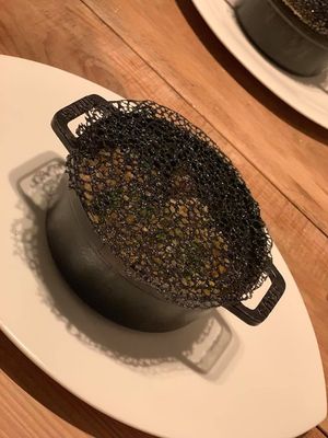 Quinoa with bamboo shoots and vegetables, and bamboo charcoal net on top at Chez Tomo in Tokyo