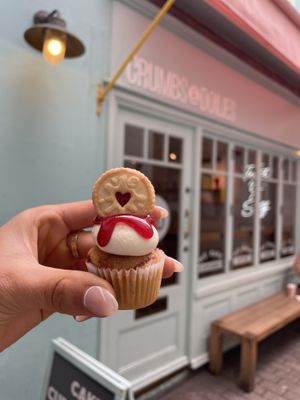 vegan thumb print mini cupcake (also have regular sized and other flavours) filled with fruit filling  at Crumbs & Doilies in London