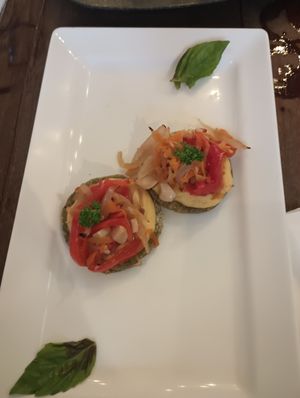 Vegan crostini, and hummus and pumpkin pizzas both made vegan. at La Masa Pizzería Conceptual in San Juan