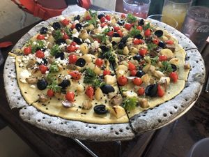 Hummus pizza with black sesame crust  at La Masa Pizzería Conceptual in San Juan