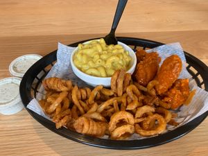 Buffalo wings with curly fries and mac and cheese  at Korny Vibes in Houston