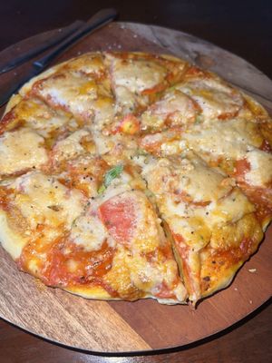 Vegan pizza with cashew cheese  at Segara Lestari in Tejakula
