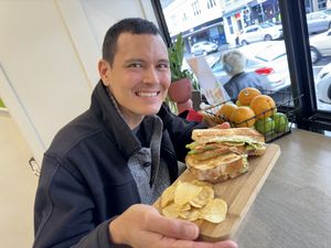 The man and his dinner  at Jumi's Cafe in South Yarra