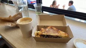 Latte with soy milk, strong and delicious. Mushroom truffle toastie    at Jumi's Cafe in South Yarra
